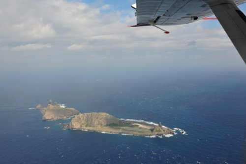 日本擬討論對中國海監飛機實施“警告射擊”