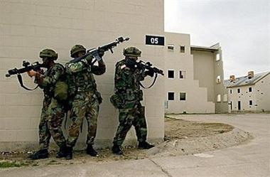 US Army soldiers train at a practice facility resembling an urban environment in Fort Hood, Texas, in 2003.(AFP/File/Roberto Schmidt)