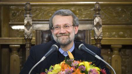 Iranian parliament speaker Ali Larijani smiles during a news conference at the old Iranian Parliament building in Tehran November 30, 2009.(Xinhua/Reuters File Photo)