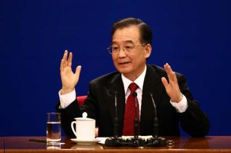 Chinese Premier Wen Jiabao answers questions during a press conference after the closing meeting of the Third Session of the 11th National People's Congress (NPC) at the Great Hall of the People in Beijing, capital of China, March 14, 2010. (Xinhua/Yao Dawei)