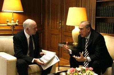 Greece's Prime Minister George Papandreou (L) meets Secretary-General of the Organisation for Economic Cooperation and Development (OECD) Angel Gurria in Athens March 15, 2010. REUTERS/Yiorgos Karahalis