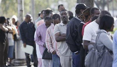 Several hundred Haitians from the U.S. waited in line outside the Norte Dame Catholic Church in Miami, Tuesday, Jan. 19, 2010, to get advice on their legal status.(AP Photo/J Pat Carter)