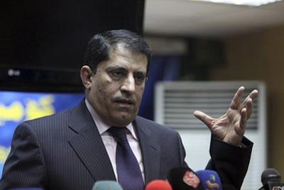 Qassim al-Aboudi of the Independent High Electoral Commission (IHEC) speaks to reporters in Baghdad, Iraq, Saturday, March 13, 2010. (AP Photo/Karim kadim)