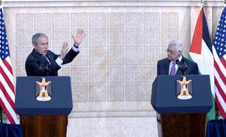 United States President George W. Bush (L) speaks while Palestinian President Mahmoud Abbas looks on during their joint news conference held in the West Bank town of Ramallah, Jan. 10, 2008. Bush said that he believes an Israeli-Palestinian peace treaty will be signed before he leaves office early next year.(Xinhua Photo)