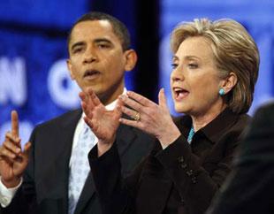 Democratic presidential candidates U.S. Senator Barack Obama (D-IL) (L) and U.S. Senator Hillary Clinton (D-NY) gesture during the CNN/Los Angeles Times Democratic presidential debate in Hollywood, California Jan. 31, 2008. (Xinhua/Reuters Photo)