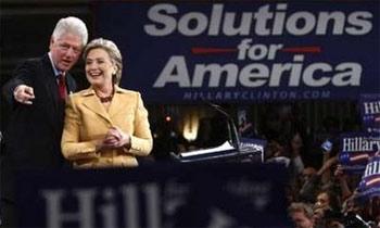 Democratic presidential candidate Senator Hillary Clinton (D-NY) stands with her husband former U.S. President Bill Clinton at her "Super Tuesday" primary election night rally in New York February 5, 2008. [Photo: Reuters]