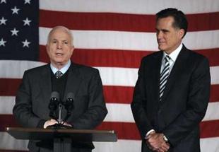 Republican presidential candidate US Senator John McCain (R-AZ) speaks after receiving the endorsement of former primary rival Mitt Romney, right, at Romney's campaign headquarters in Boston, Massachusetts February 14, 2008. REUTERS/Neal Hamberg