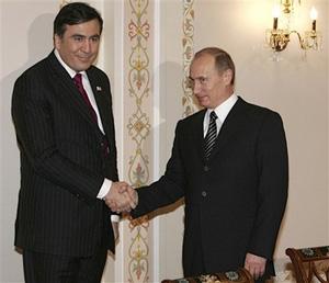 Russian President Vladimir Putin, right, greets Georgian President Mikhail Saakashvili during their meeting in the Novo-Ogaryovo outside Moscow, Thursday, Feb. 21, 2008. (AP Photo/RIA-Novosti, Mikhail Klimentyev, Presidential Press Service)