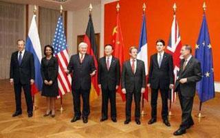 German Foreign Minister Frank-Walter Steinmeier (3rdL) gestures as he poses for a family picture with his  counterparts Sergei Lavrov of Russia (L-R), U.S. Secretary of State Condoleezza Rice, Yang Jiechi of China, Bernard Kouchner of France, David Miliband of Great Britain and EU foreign policy chief Javier Solana in Berlin, January 22, 2008, before their meeting on Iran. (Xinhua/Reuters Photo)