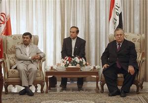 Iranian President Mahmoud Ahmadinejad, left, and his Iraqi counterpart Jalal, Talabani, right, sit as their ministers sign bilateral agreements in Baghdad, Iraq, Monday, March 3, 2008. (AP Photo/Hadi Mizban)