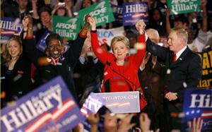 US Democratic presidential candidate Senator Hillary Clinton (C) celebrates with supporters at her Ohio primary election night rally in Columbus, Ohio March 4, 2008. At left is her daughter, Chelsea Clinton. [Agencies]