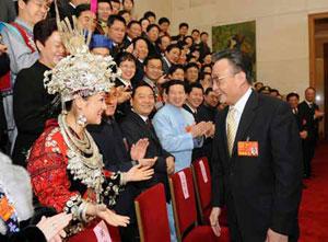 While joining a discussion in the Guizhou delegation, Wu Bangguo called on the people in Guizhou Province to promptly recover from the recent snow and ice storms and minimize losses. (Xinhua Photo)