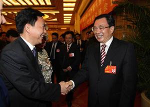 He Guoqiang, joining a panel discussion with legislators from Hunan Province, the worst-hit area of the snow havoc, stressed that the local government should learn from the disaster resisting and relief work, better the emergency response system and strengthen the ability to resist disasters. (Xinhua Photo)