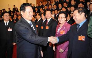 Zhou Yongkang stressed stability while talking with NPC deputies from Heilongjiang Province. He said government officials at all levels should regard maintaining social security as the primary task..(Xinhua Photo)