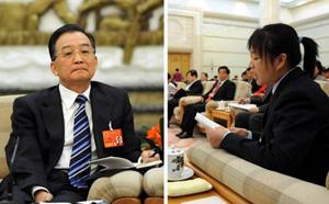 Chinese Premier Wen Jiabao on Friday listens carefully to a duputy while joining the group discussion of Guangdong. He urged people in Guangdong to further free their mind and continue to take the lead in the modernization process.(Xinhua Photo)