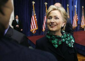 Democratic presidential candidate Senator Hillary Clinton talks with a member of the audience after delivering a campaign speech on the war in Iraq at George Washington University in Washington, Mar. 17, 2008.(Xinhua/Reuters Photo)