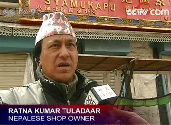 A Nepalese Shop Keeper at Barkor Market survived the riots but it left him terrified and his shop has been closed for several days.