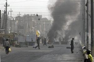 Tires are set on fire and road is blocked in Sadr City, Baghdad Iraq as Mahdi Army militia members clash with the Iraqi government forces backed by the US military, Wednesday March 26, 2008. Clashes were also reported between Iraqi forces and Mahdi Army in Diwaniyah, south of Baghdad. [Agencies]