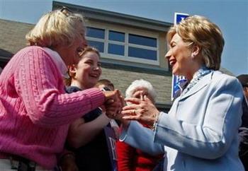 Democratic presidential candidate Sen. Hillary Clinton (D-NY) is greeted by supporters outside a polling station during a campaign stop in Conshohocken, Pennsylvania April 22, 2008. [Agencies]