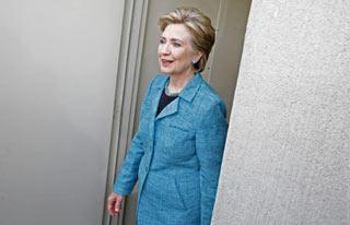 U.S. Democratic presidential candidate Hillary Clinton (D-NY) tours race car driver Sarah Fisher's garage at the Indianapolis Motor Speedway in Speedway, Indiana May 6, 2008. (Xinhua/Reuters Photo)