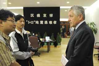 U.S. Senator Chuck Hagel answers questions from press before signing on the book of condolence during a mourning ceremony held at the Chinese Embassy in Washington. DC, United States, on May 20, 2008. Staffers of the Embassy, local Chinese and overseas Chinese and some U.S officers attended the mourning ceremony on Tuesday for the victims of the 8.0-magnitude quake on Richter scale hitting southwest and northwest China's regions on May 12.(Xinhua Photo)