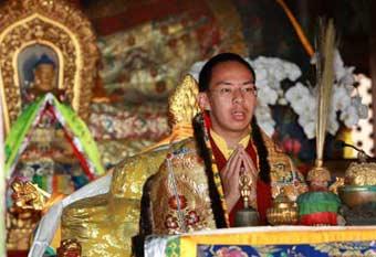 The 11th Panchen Erdeni Gyaincain Norbu prays for peace in the regions ravaged by an 8.0-magnitude earthquake on Richterr scale on May 12 in the Yonghe Lamasery in Beijing, capital of China, May 21, 2008. (Xinhua Photo)