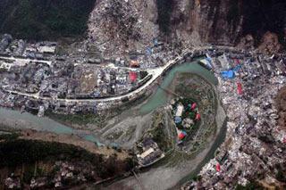 Professionals and materials are airdropped for operations to blow a barrier lake at Tangjiashan, Beichuan County, which was formed by landslides after the May 12 earthquake and now blocks the river Jianhe.(Xinhua Photo)