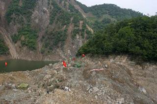 The aerial photo taken on May 26, 2008 shows the landslide mud that formed the Tangjiashan quake lake near Beichuan County in southwest China's Sichuan Province. The earthquake-induced lake is at risk of bursting and threatening thousands of people downstream. (Xinhua/Zhu Wei)