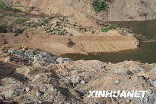 Tangjiashan barrier lake looks almost certain to burst its banks.