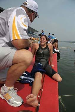 Natalie Du Toit of South Africa talks to her coach after women's marathon 10km competition at the Beijing 2008 Olympic Games swimming event in Beijing, China, Aug. 20, 2008. Natalie Du Toit ranked the 16th of the event. Du Toit, whose left leg was amputated in 2001 after she was injured in a road accident, is an athlete for both Beijing 2008 Olympic Games and Paralympic Olympics. (Xinhua/Liu Dawei)