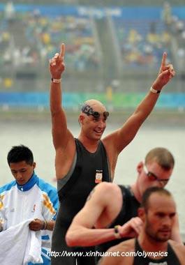 Maarten van der Weijden of the Netherlands celebrates after men's marathon 10km of Beijing 2008 Olympic Games swimming event in Beijing, China, Aug. 21, 2008. Maarten van der Weijden grabbed the gold medal. (Xinhua/Wang Lei)