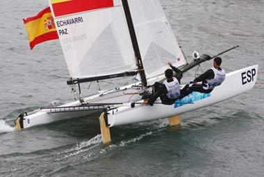 (L-R) Fernando Echavarri and Anton Paz of Spain fly their national flag.