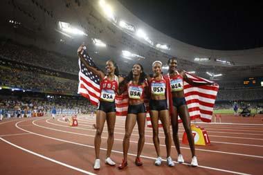 Runners of the United States celebrate after the women's 4x400m relay final at the National Stadium, also known as the Bird's Nest, during Beijing 2008 Olympic Games in Beijing, China, Aug. 23, 2008. The team of the United States won the title with 3:18.54.(Xinhua/Liao Yujie)