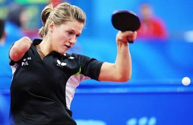 Natalia Partyka of Poland returns the ball during a Women's Individual (Class 10) Group A match against Audrey le Morvanat of France at the Beijing 2008 Paralympic Games table tennis event on Sept. 7, 2008. Partyka won 3-0. The 19-year-old Polish player, who was born with a right arm that ends at the elbow, is the Paralympic champion in Athen 2004. Before defending her Paralympic title, she played in the table tennis team event at Beijing 2008 Olympic Games, which made her one of only two athletes, along with South African swimmer Natalie du Toit, to compete in both Olympic and Paralympic in Beijing.(Xinhua Photo)