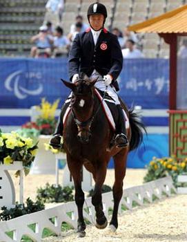 Rider Yip Siu Hong of Hong Kong rides horse Icy Bet during the Individual Championship Test (Grade II) of the Equestrian Events of the Beijing 2008 Paralympic Games at Hong Kong Olympic Equestrian Venue (Sha Tin) in Hong Kong, south China, Sept. 8, 2008. Yip Siu Hong finished 18th with a score of 50.545.(Xinhua Photo)