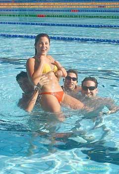 Four Paralympic athletes from Argentina play with water at the Paralympic Village in Beijing, September 12, 2008.