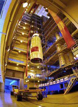 The undated photo shows the Shenzhou-7 manned spaceship is lifted to dock with the Long-March II-F rocket at an assembly plant. The spaceship has been finished docking with the rocket recently. (Xinhua/Qin Xian'an) 