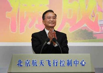 Chinese Premier Wen Jiabao applauds after reading out the congratulation speech on China's first-ever spacewalk mission at Beijing Space Command and Control Center in Beijing, capital of China, on Sept. 28, 2008. Premier Wen Jiabao watched the return of China's Shenzhou-7 spacecraft in a live transmission in the center. (Xinhua/Pang Xinglei)