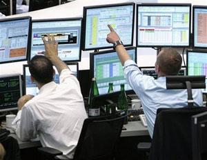 Brokers are seen at the stock market in Frankfurt, central Germany, Monday, Oct. 6, 2008. European stock markets plunged Monday as government bank bailouts in the U.S. and Europe failed to alleviate fears that the global financial crisis would depress world economic growth.(AP Photo/Michael Probst)