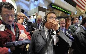 Traders work on the New York Stock Exchange floor, Monday Oct. 6, 2008. Wall Street tumbled again Monday, joining a sell-off around the world as fears grew that the financial crisis will cascade through economies globally despite bailout efforts by the U.S. and other governments.(AP Photo/Richard Drew)