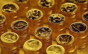 Gold bullion coins known as Krugerrands are pictured in the mint where they are manufactured in Midrand outside Johannesburg October 3, 2008.REUTERS/Siphiwe Sibeko