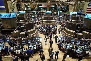 Traders work on the floor of the New York Stock Exchange (NYSE) moments after the opening bell in New York City. Panic-selling returned to global stock markets on Wednesday, with the leading Dow Jones industrial index shedding 5.6 percent, as fears of global recession stalked investors.(AFP/Getty Images/Spencer Platt)