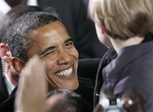 Democratic Presidential candidate Sen. Barack Obama, gives a wink to a young supporter during a rally at the Virginia Beach Amphitheatre in Virginia Beach, Va., Thursday, Oct. 30, 2008.(AP Photo/Steve Helber)