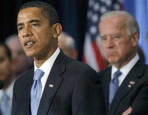 President-elect Obama speaks during a press conference on the economy in Chicago, Friday, Nov. 7, 2008 as Vice President-elect Biden listens in the background.(AP Photo/Pablo Martinez Monsivais)