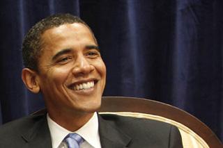 President-elect Barack Obama smiles during a meeting in Obama's transition office in Chicago, November 17, 2008.(Xinhua/Reuters Photo)