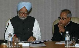 India's Prime Minister Manmohan Singh (L) and Foreign Minister Pranab Mukherjee attend an all-party meeting in New Delhi November 30, 2008. REUTERS/B Mathur