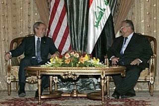 U.S. President George W. Bush (L) meets with Iraqi President Jalal Talabani at Salam Palace in Baghdad. (AFP/Pool/Mohammed Jalil)