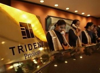 Receptionists answer telephones at the front desk of The Trident hotel in Mumbai, on December 20, 2008. Two luxury hotels that were stormed by Islamist militants re-opened amid tight security in Mumbai Sunday, less than a month after devastating attacks that rocked India's financial and entertainment hub.(AFP/File/Sajjad Hussain)