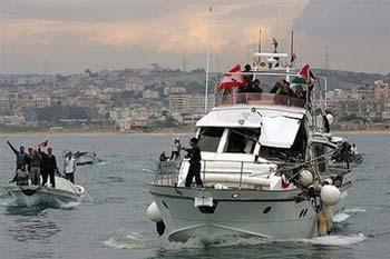 An Israeli naval vessel collided on Tuesday with a boat carrying activists and medical supplies that was trying to break the blockade of Gaza,forcing it to divert to a port in Lebanon.(AFP/Mahmoud Zayat) 