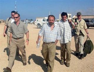 British reporter Colin Freeman of The Sunday Telegraph, centre, and Spanish freelance photographer Jose Cendon, second right, are seen in the semiautonomous region of Puntland in northern Somalia Sunday Jan 4, 2009.(AP Photo)